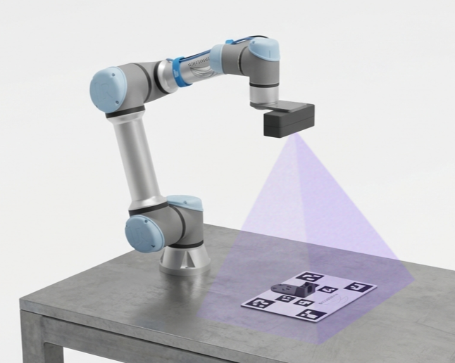 Camera mounted on the robot arm, pointing at the calibration board